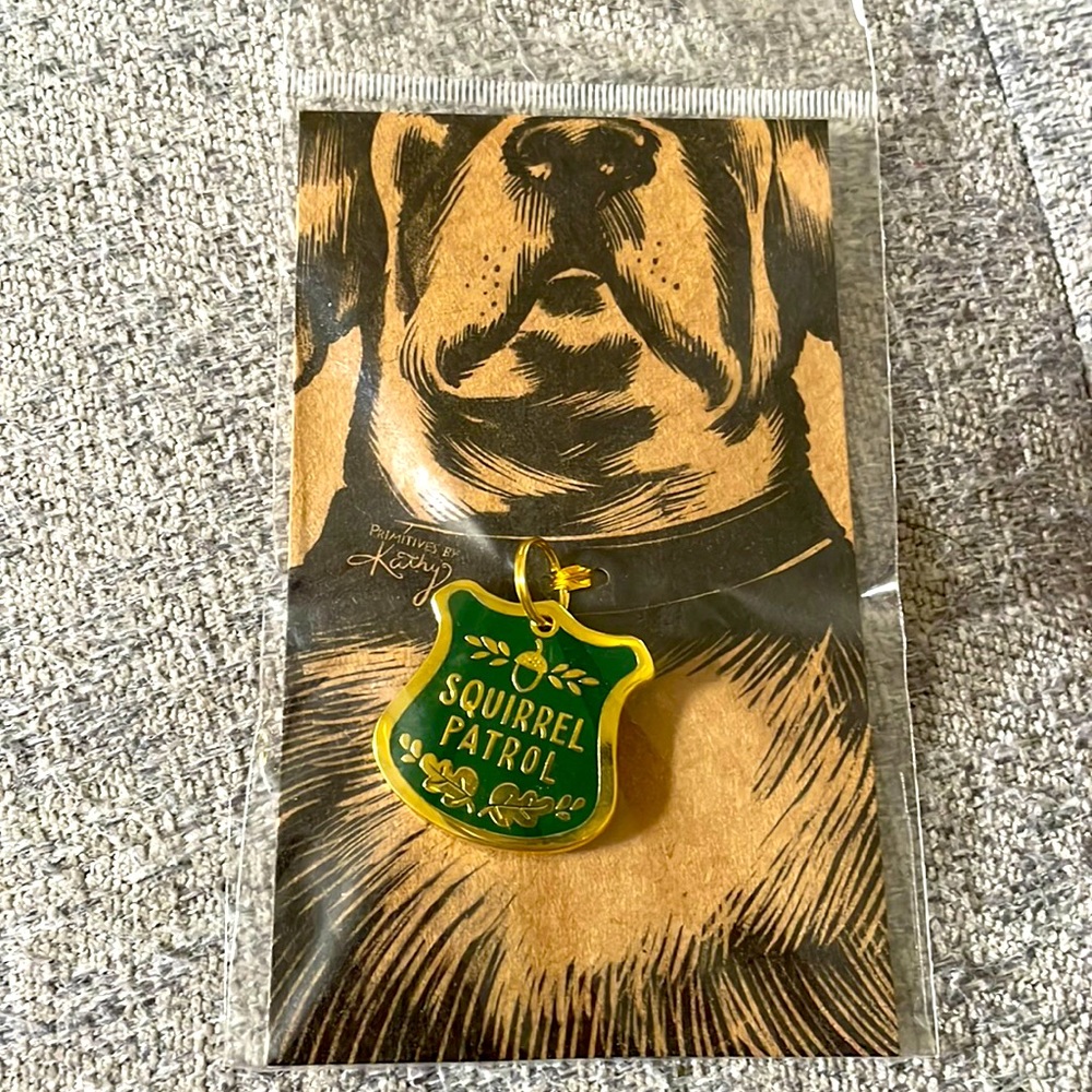 “Squirrel patrol” dog tag.  New in original packaging.